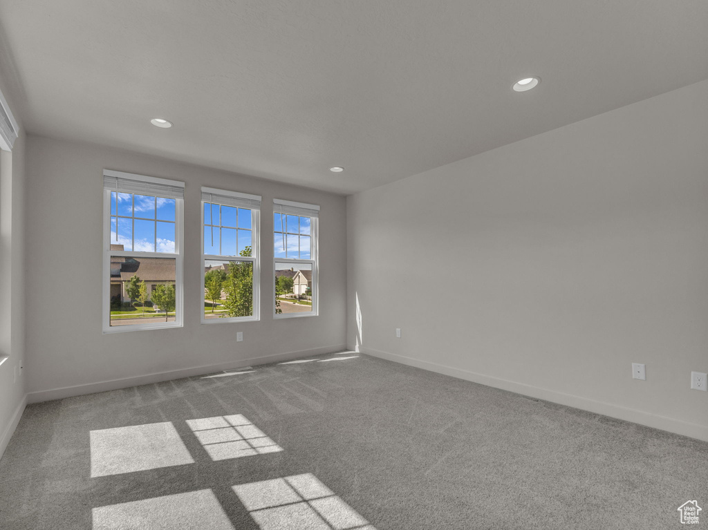 Spare room featuring carpet flooring and recessed lighting