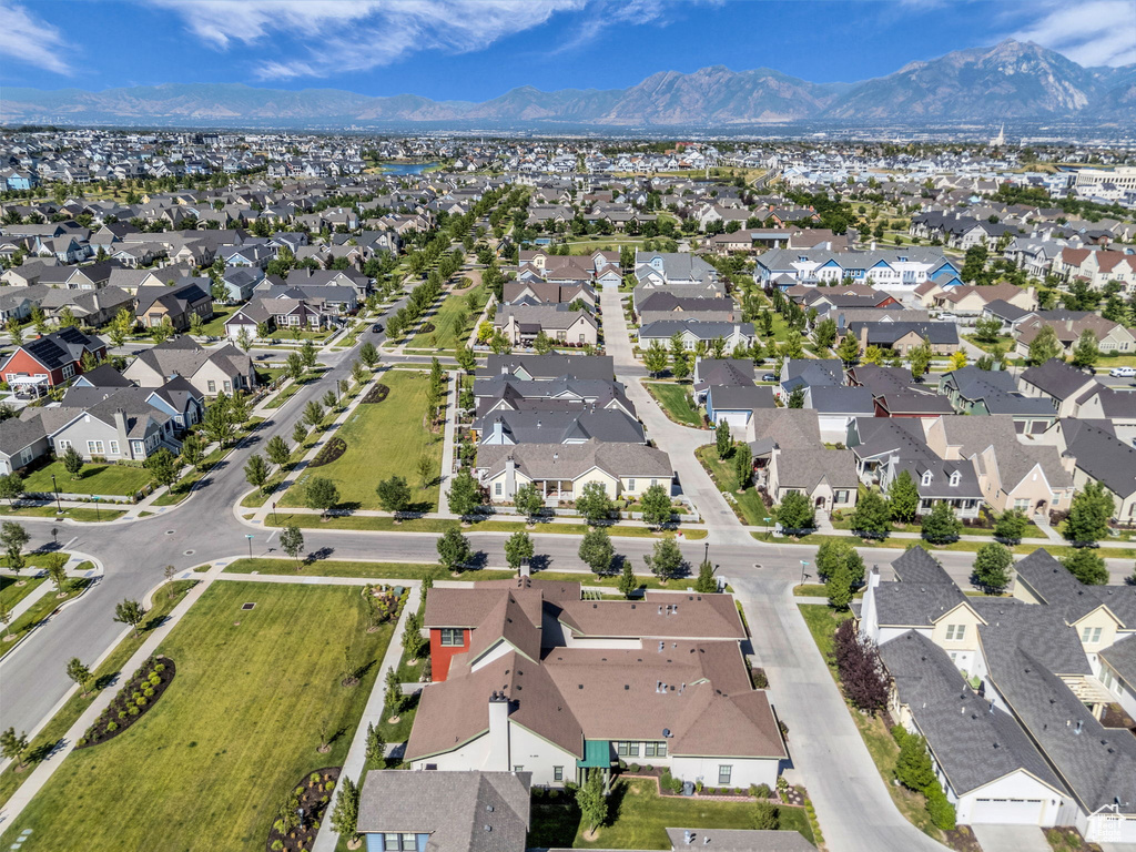 Aerial overview of property\'s location with a mountainous background and nearby suburban area