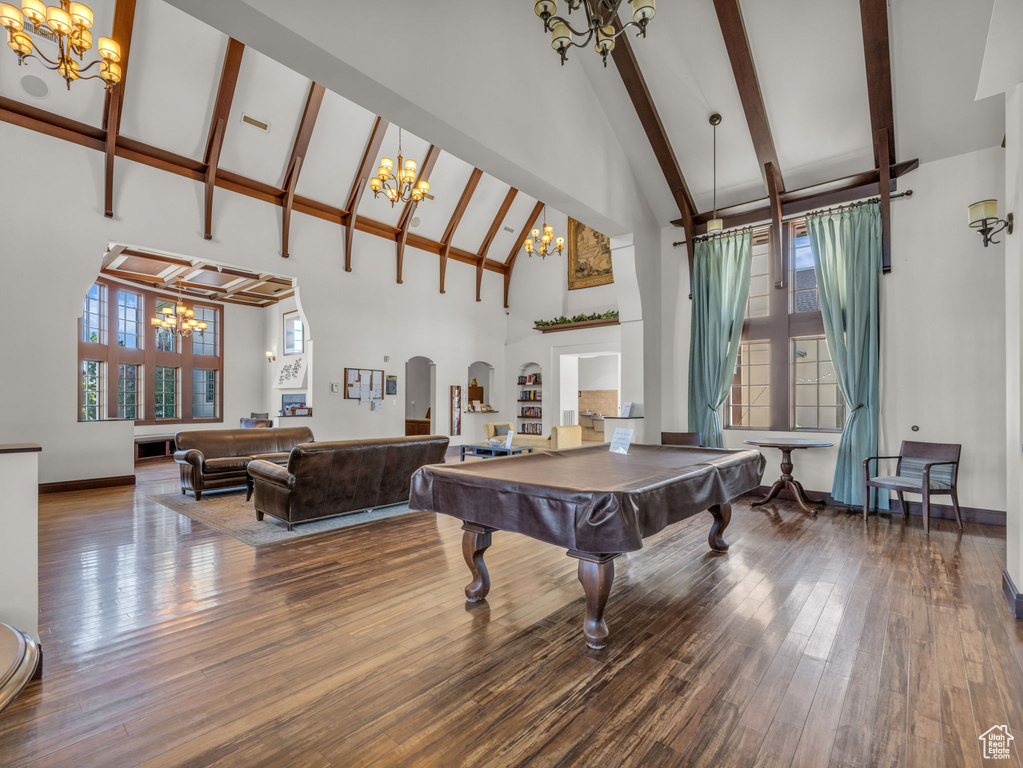 Playroom featuring a chandelier, high vaulted ceiling, billiards table, beamed ceiling, and wood finished floors