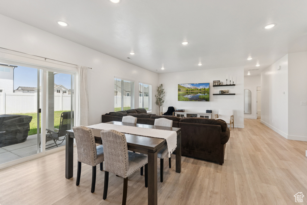 Dining space featuring light wood-type flooring and recessed lighting