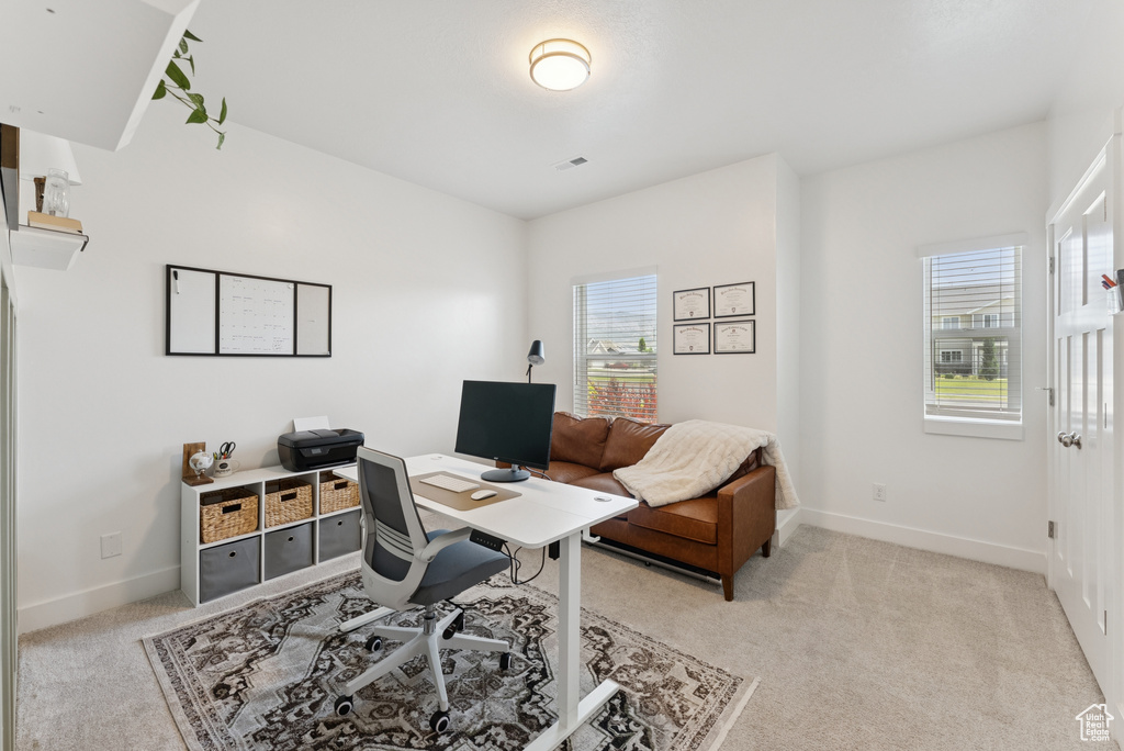 Office area with light colored carpet