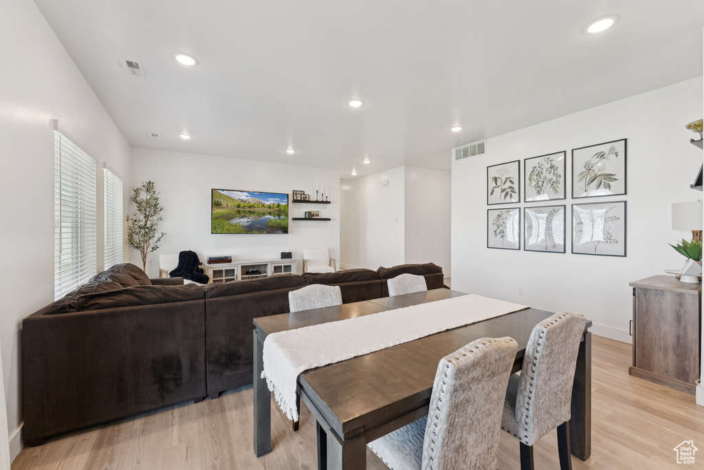 Dining room featuring light wood-style flooring and recessed lighting