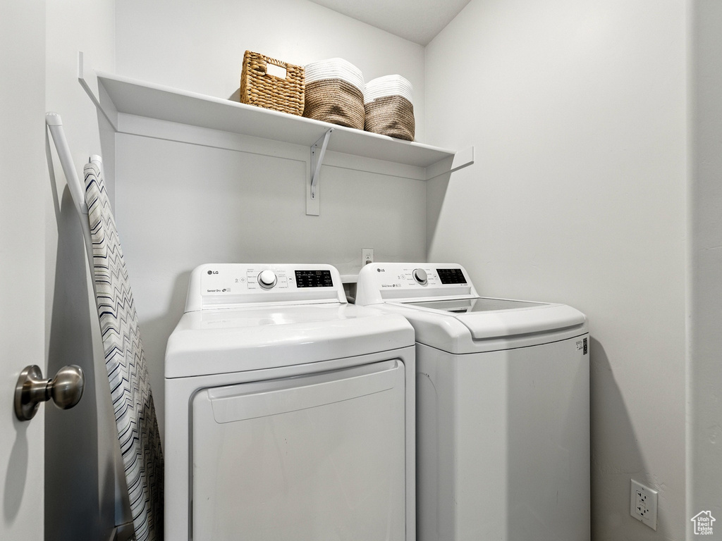 Laundry room featuring independent washer and dryer