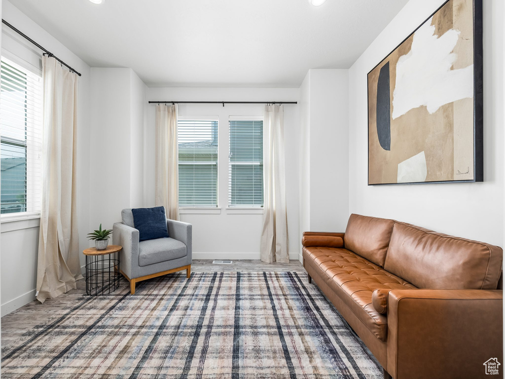 Sitting room with baseboards and recessed lighting