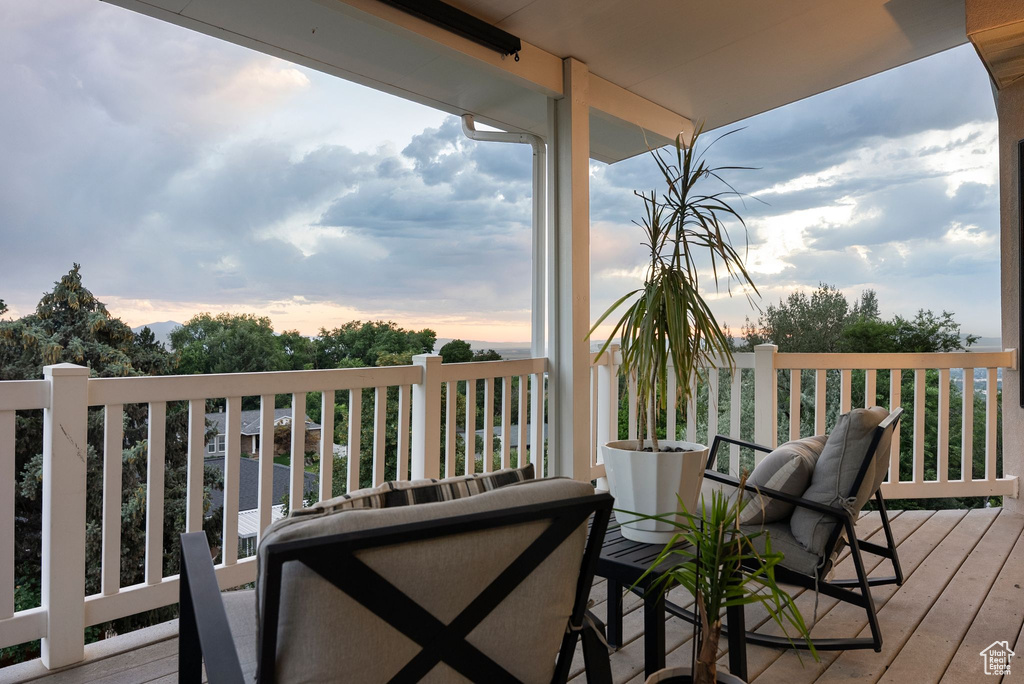 Deck at dusk featuring an outdoor hangout area