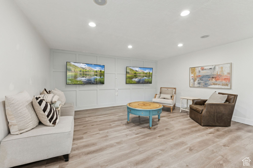 Living area featuring recessed lighting and light wood-style floors