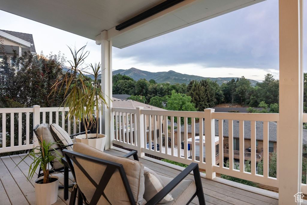 Wooden deck featuring a mountain view