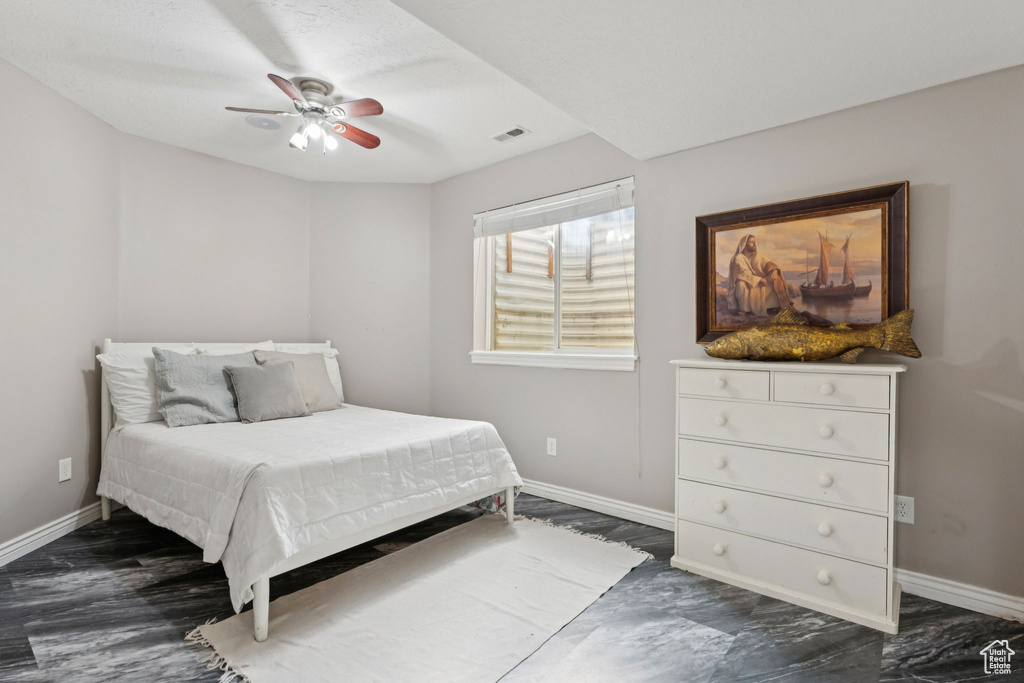 Bedroom with baseboards and ceiling fan
