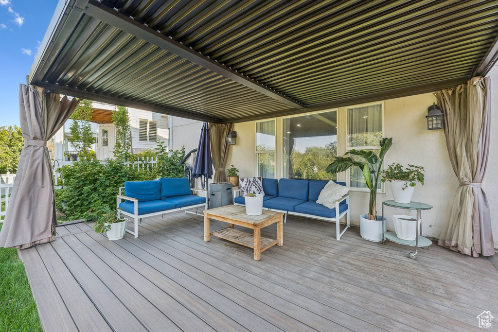 Wooden terrace with an outdoor living space