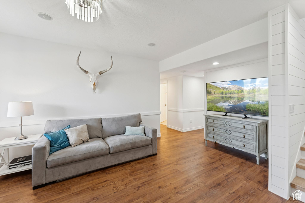 Living area featuring wood finished floors and recessed lighting