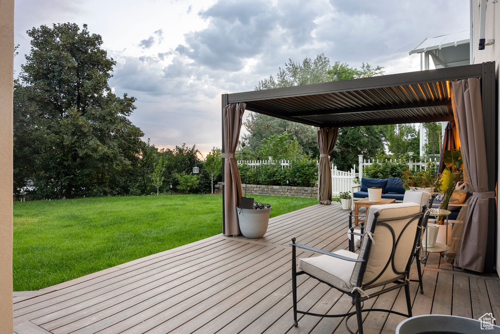 Deck featuring a yard