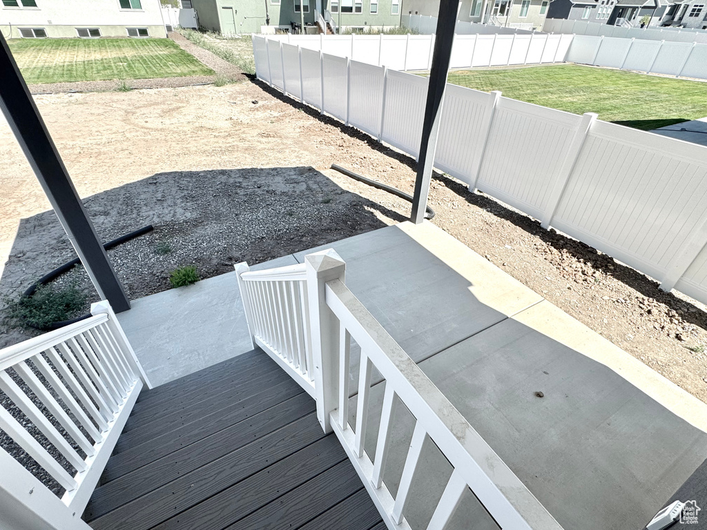 Deck featuring a fenced backyard, a residential view, and a patio area