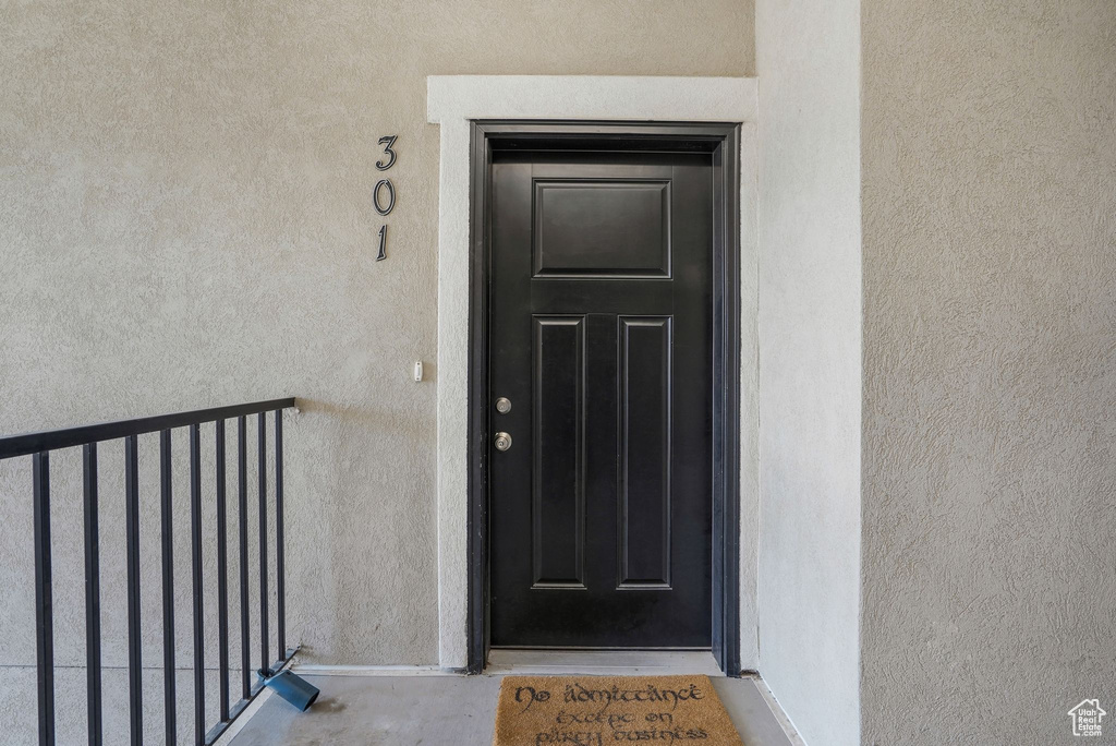 View of exterior entry with stucco siding
