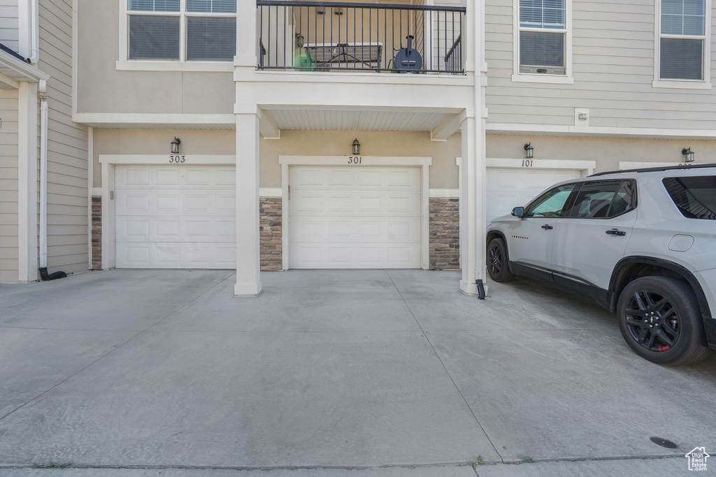 Garage featuring driveway