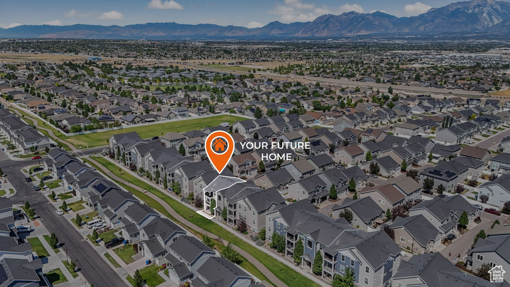 Aerial view of residential area with a mountain backdrop
