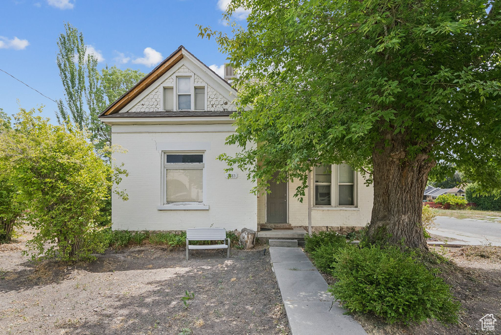 View of front of home featuring brick siding
