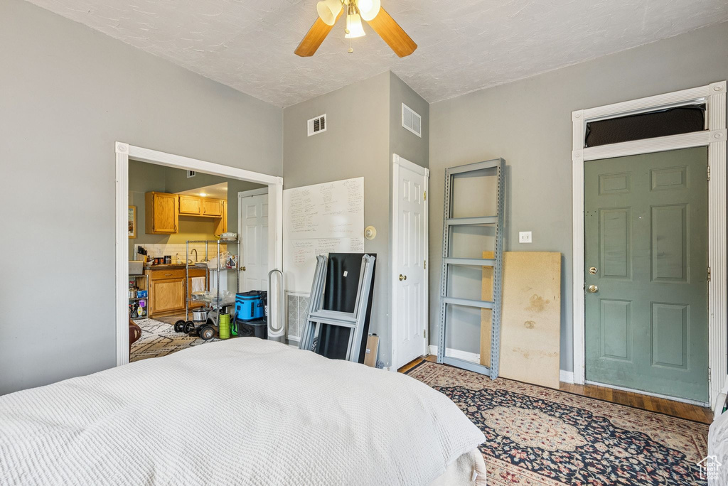 Bedroom with a ceiling fan and a closet