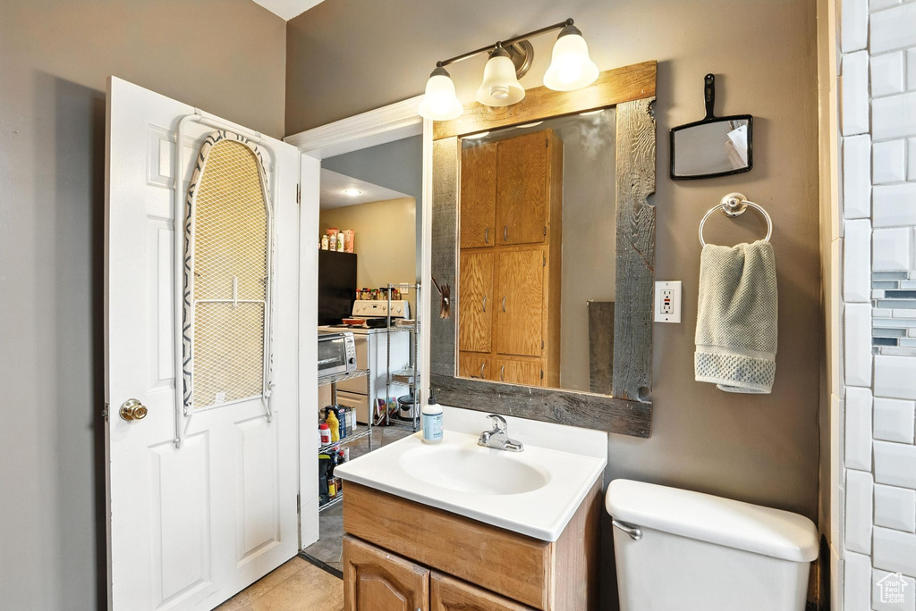 Bathroom featuring vanity and tile patterned floors
