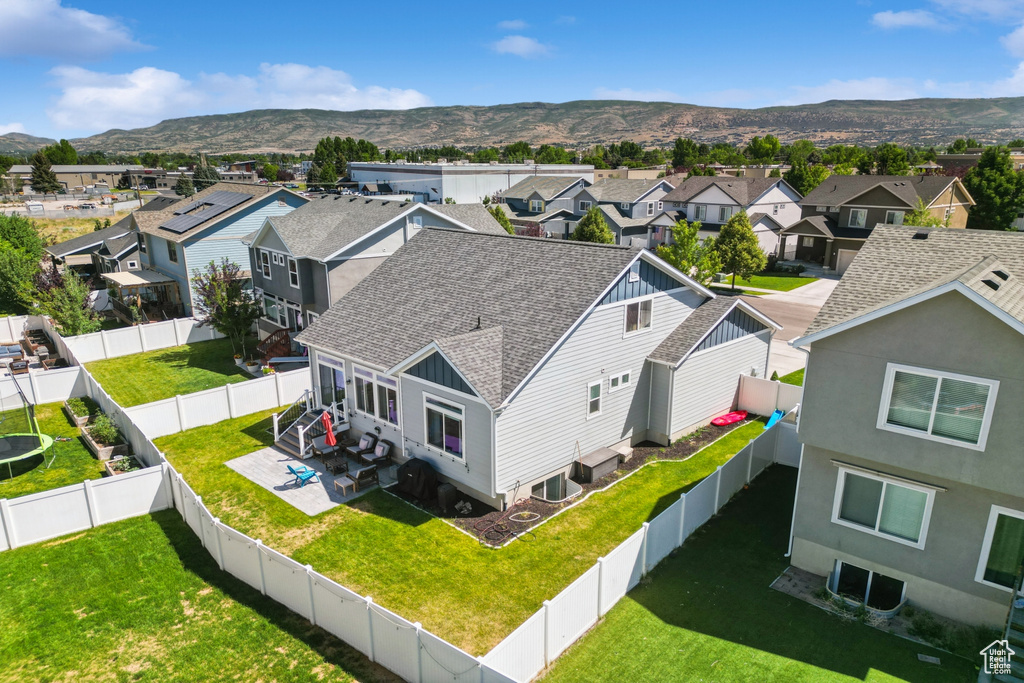 Aerial perspective of suburban area featuring a mountainous background