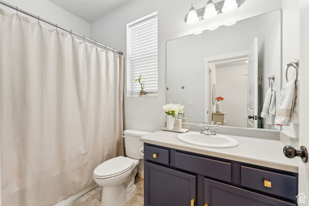Bathroom with vanity and a shower with curtain