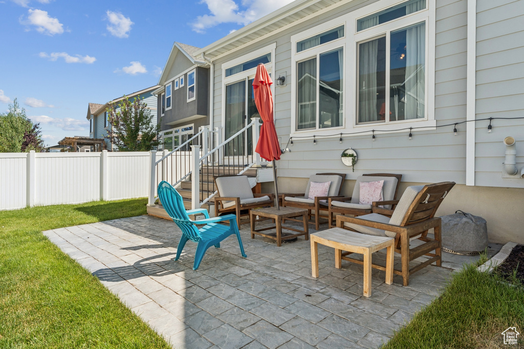 View of patio featuring an outdoor hangout area