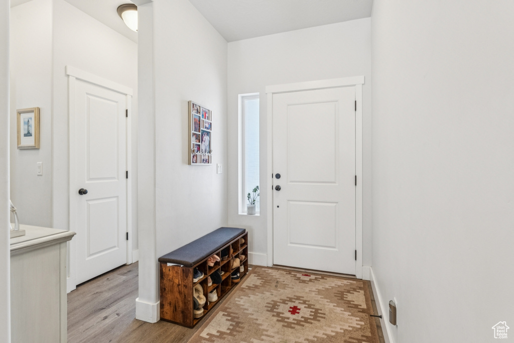 Entrance foyer featuring light wood-style floors and baseboards