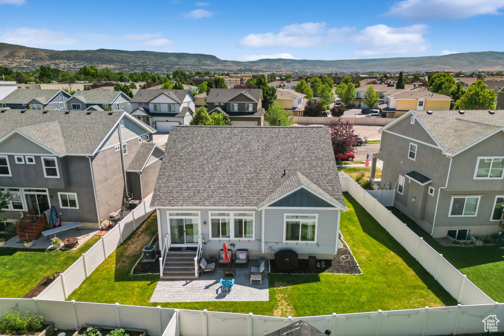 Aerial view of residential area with a mountain backdrop