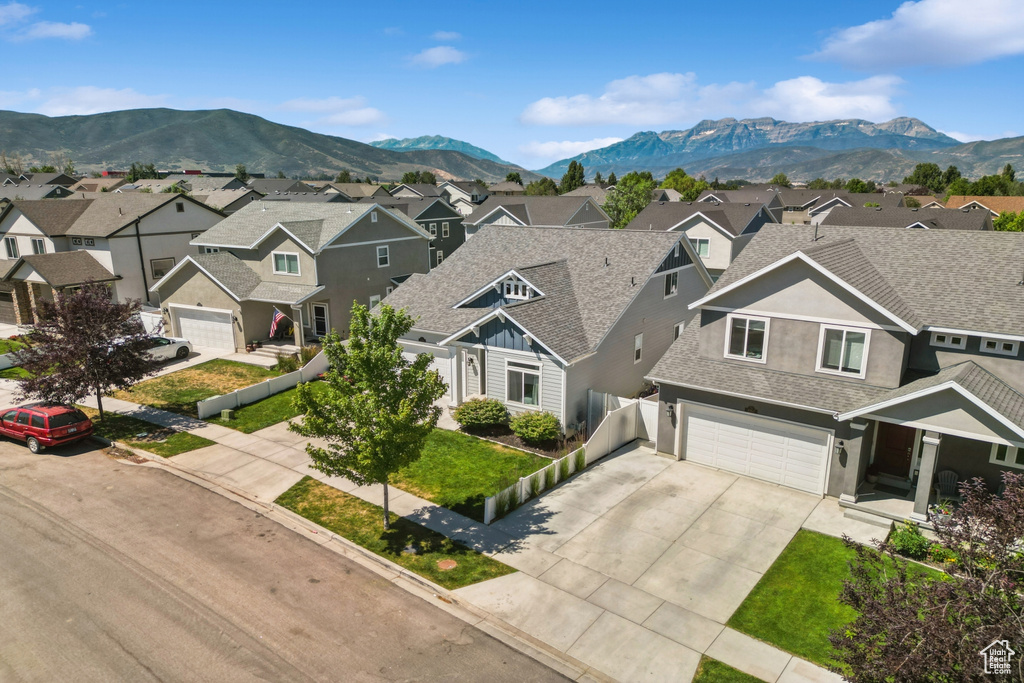 Aerial perspective of suburban area featuring a mountainous background