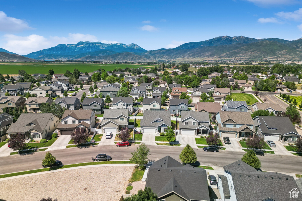 Aerial view of residential area featuring a mountain backdrop