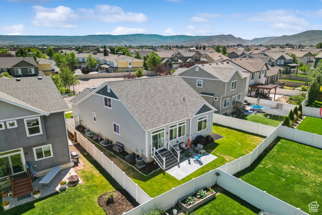Aerial perspective of suburban area with a mountain backdrop