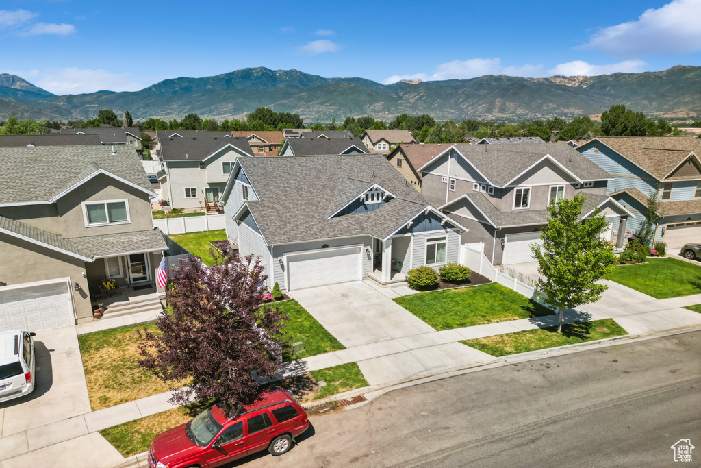 Aerial view of residential area with a mountainous background