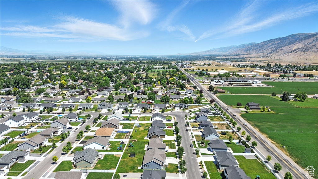 Aerial view of property and surrounding area with mountains