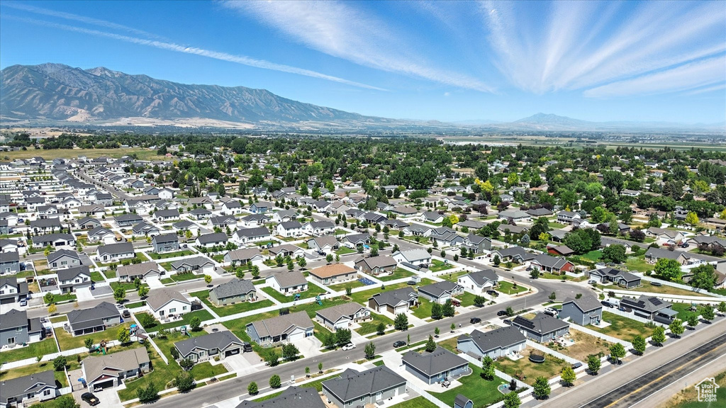 Aerial overview of property's location with a mountainous background