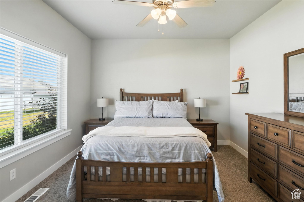 Bedroom with carpet flooring and a ceiling fan