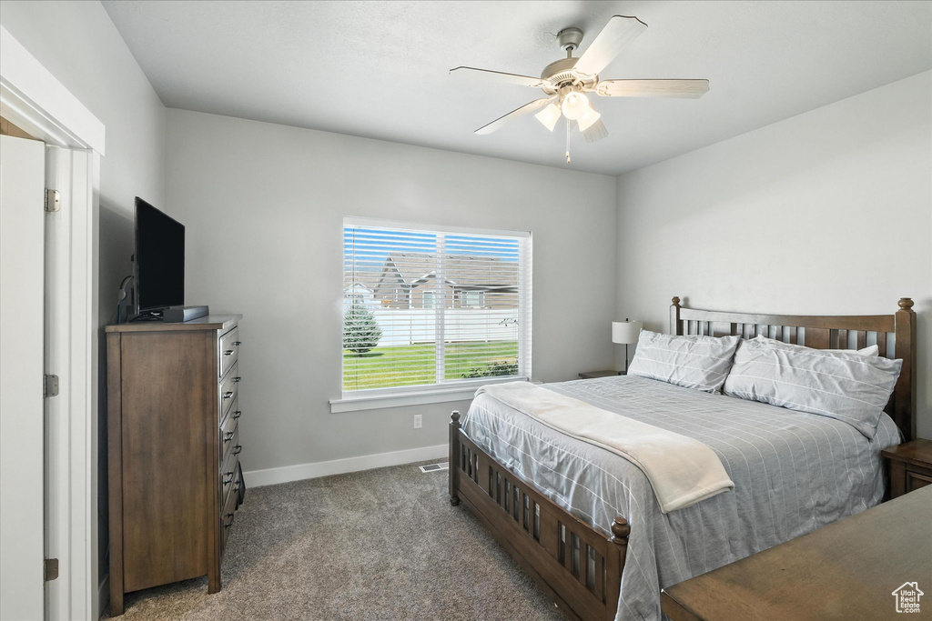 Bedroom with carpet floors and a ceiling fan