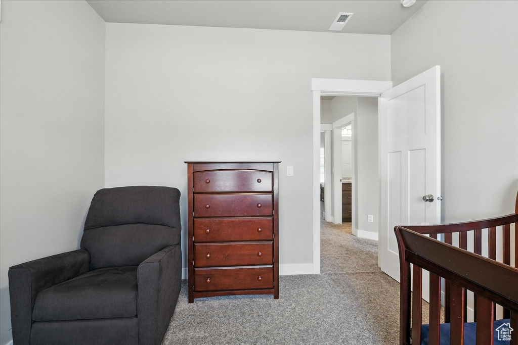Bedroom featuring carpet flooring and baseboards