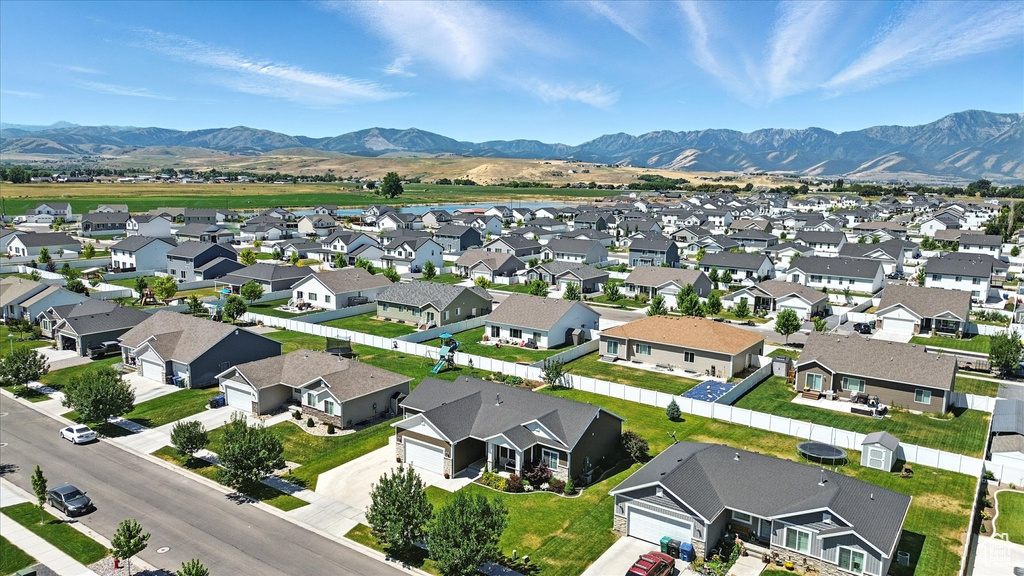 Aerial perspective of suburban area with a mountain backdrop