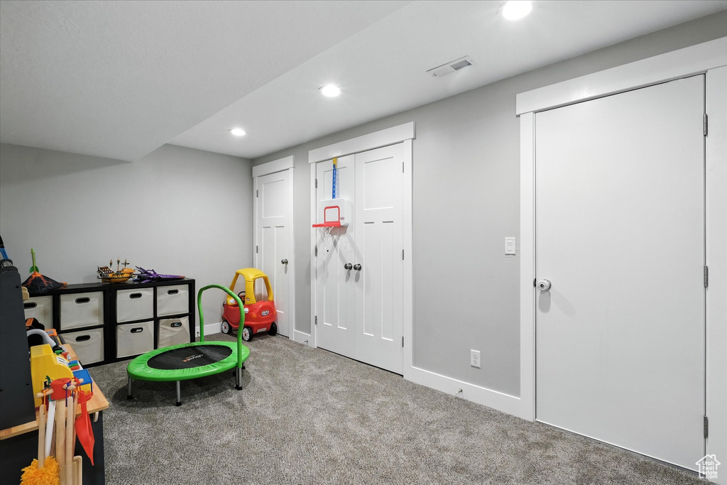 Game room with recessed lighting and carpet