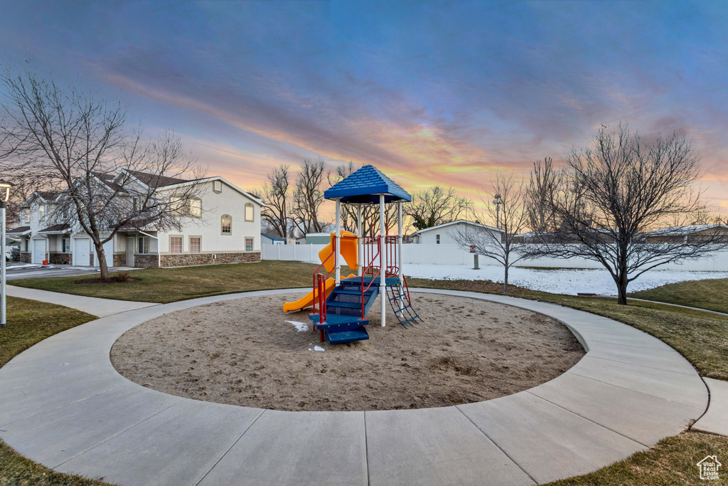 Community jungle gym featuring a lawn