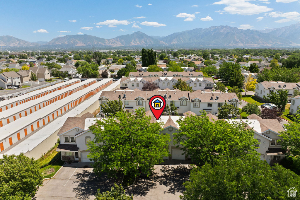 Aerial perspective of suburban area with a mountain backdrop