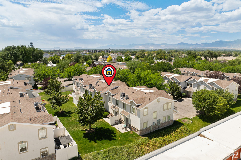 Aerial perspective of suburban area featuring a mountainous background