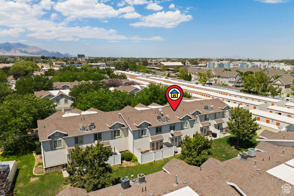 Aerial perspective of suburban area with a mountainous background