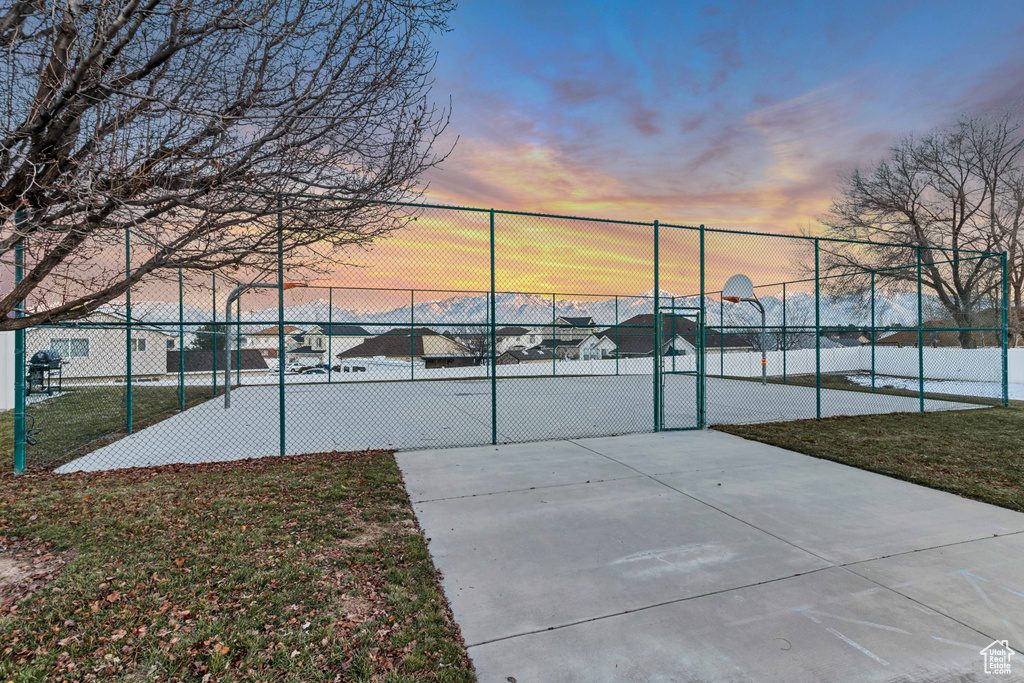 View of tennis court featuring community basketball court