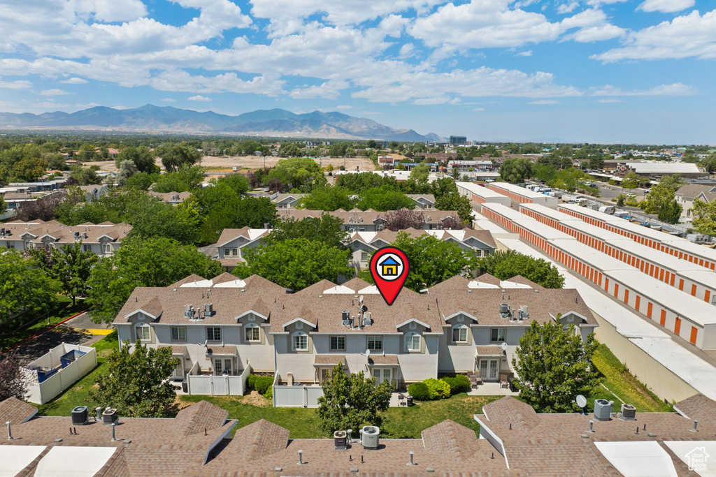 Aerial perspective of suburban area featuring a mountainous background