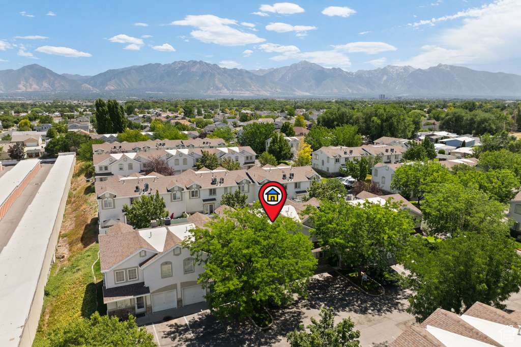 Aerial perspective of suburban area with a mountainous background