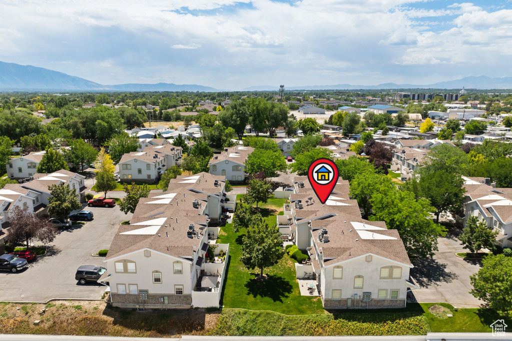 Aerial perspective of suburban area featuring a mountainous background