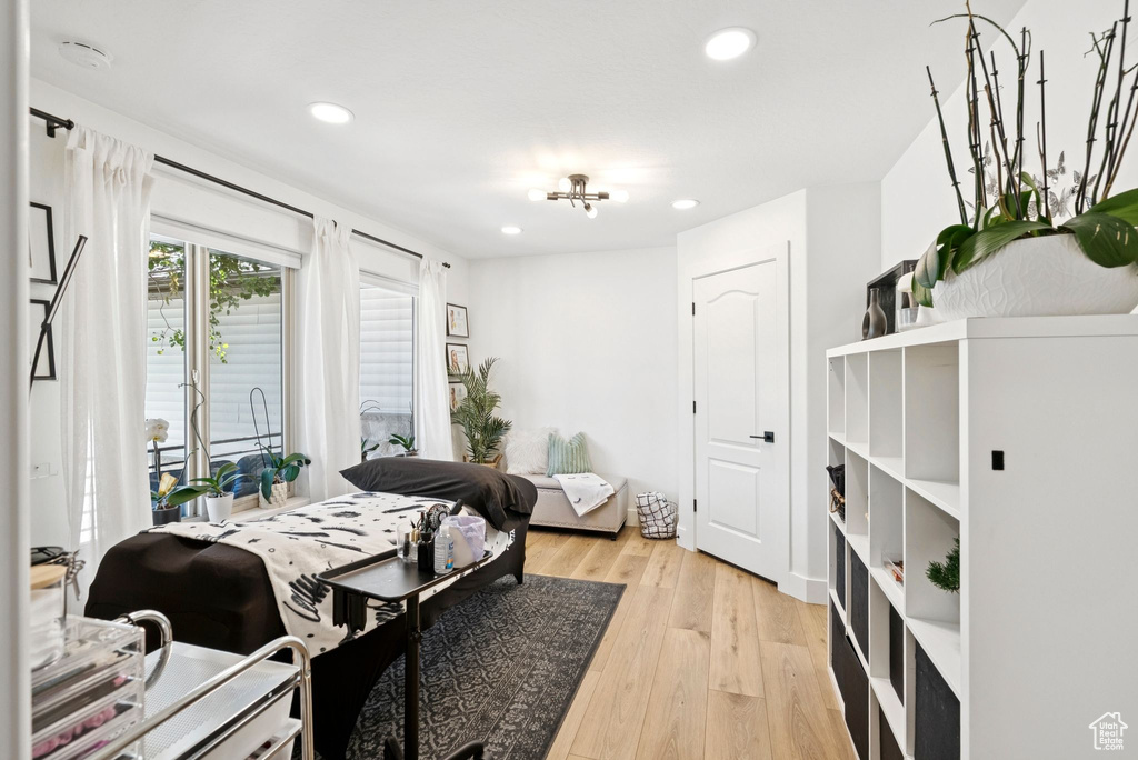 Bedroom with recessed lighting, light wood-style flooring, and access to exterior