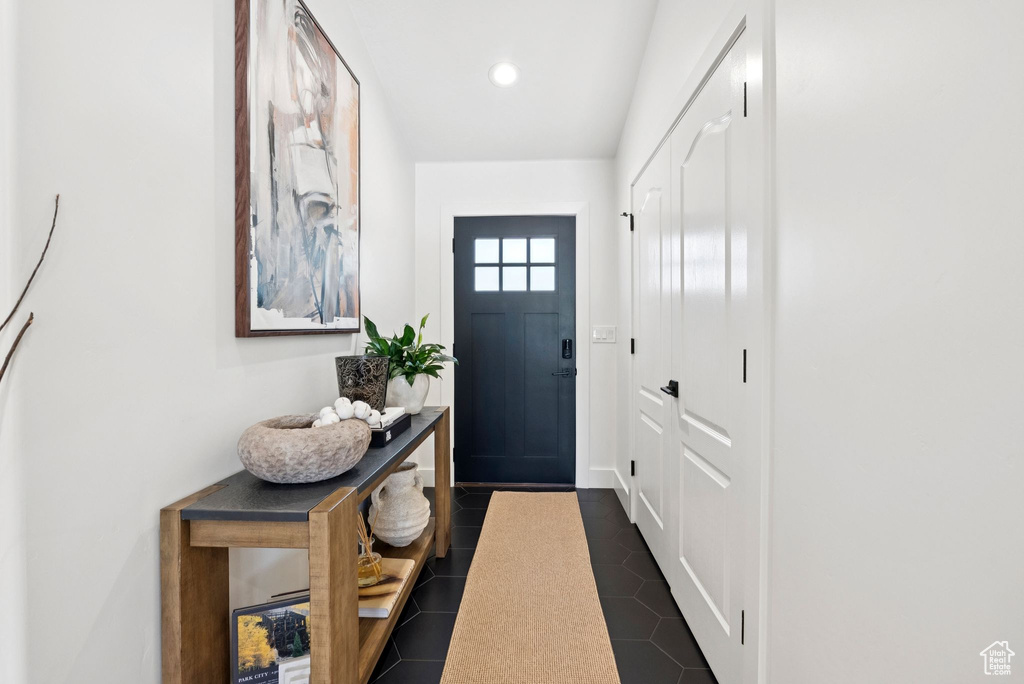 Entryway with recessed lighting and dark tile patterned flooring