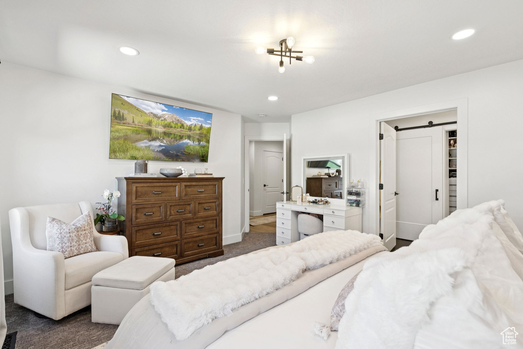 Bedroom featuring dark carpet and recessed lighting