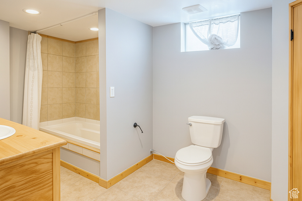 Full bathroom featuring vanity, shower / bathtub combination with curtain, and recessed lighting
